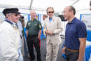 Mr. Feng Qingfeng, CEO de Lotus, sur le stand Lotus de Goodwood